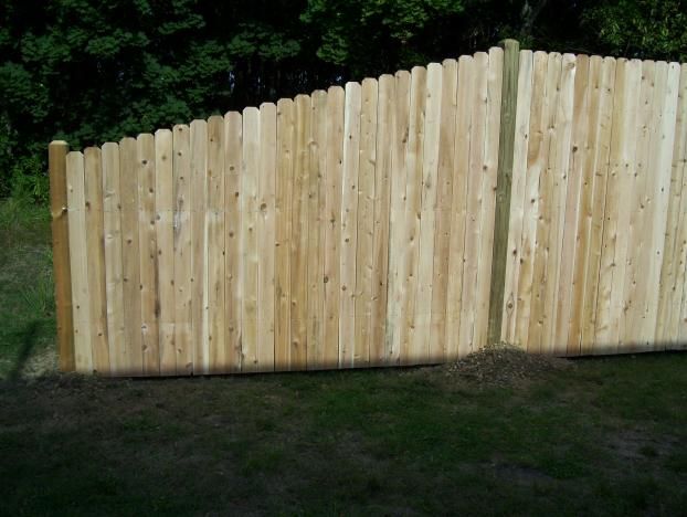 4' High to 6' High Tapered Solid Old Dog Ear Cedar Fence.  
These sections are ideal for ending a straight run. 